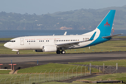 Dehong South Asian Airline Boeing 737-700 B-5818 at Auckland International Airport (NZAA/AKL) Dehong South Asian Airline Boeing 737-700 B-5818 at Auckland International Airport (NZAA/AKL)